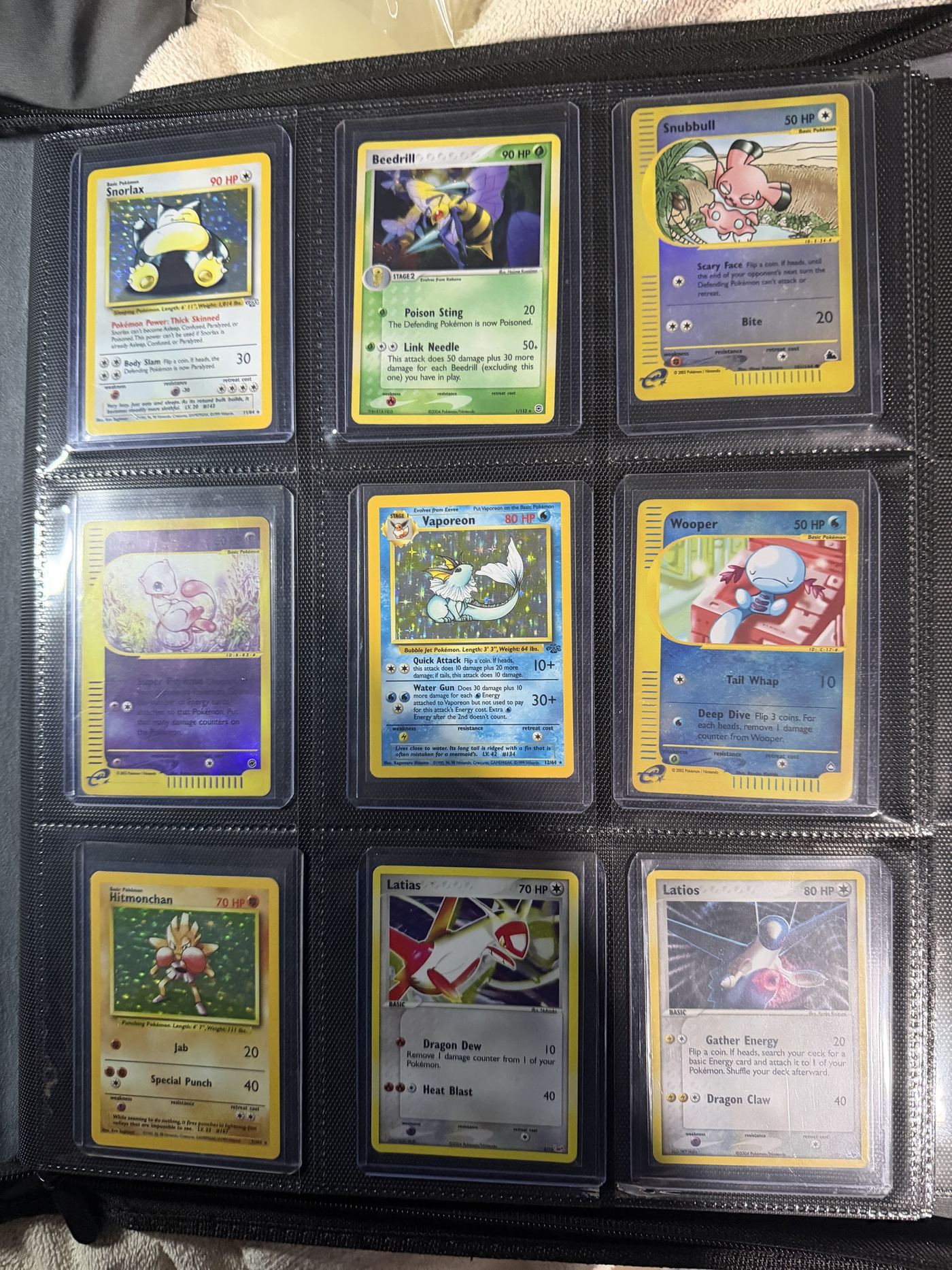 A binder page of assorted Pokémon cards, representative of a full collection Rarewake might evaluate
