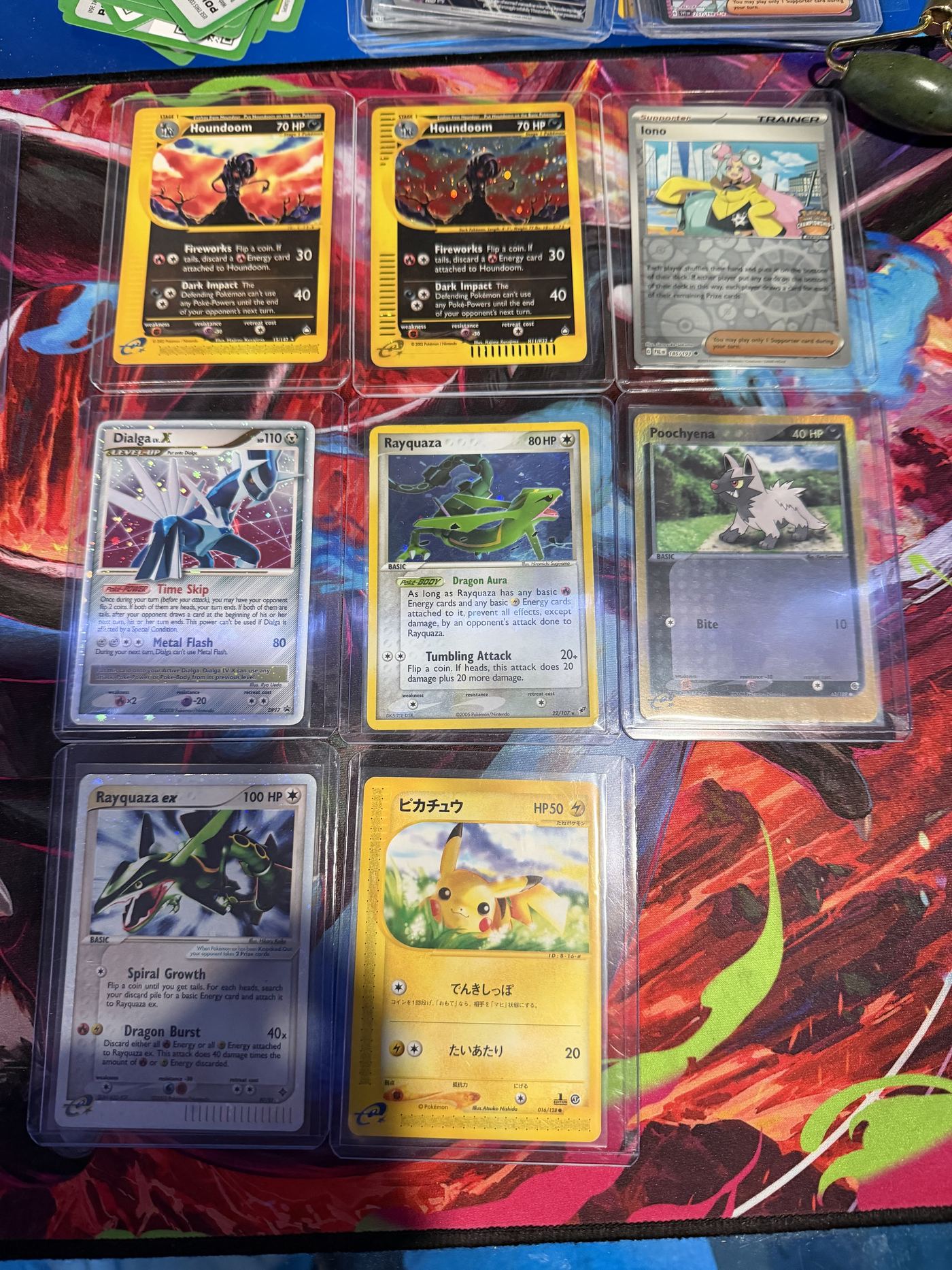 A varied binder page mixing multiple trading card sets and eras